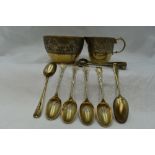 A Victorian silver gilt cream jug, sugar bowl, six coffee spoons and sugar nips all having