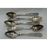 Five 19th Century Russian silver spoons of fiddle back form bearing ornately decorated terminals,