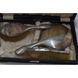 A cased three piece silver dressing table set having reid and dot decoration, Birmingham 1923, W J