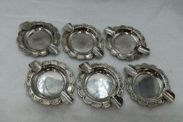 A set of six Mexican silver individual ashtrays of frilled circular form with a duo of rests, approx