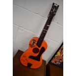 A vintage plastic toy guitar, 'Beatles Big6', pictorial sticker worn, printed signatures , no box