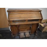 A late stained frame American organ/harmonium of typical chapel design labelled for Mason &