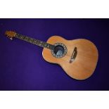 An Ovation Glen Campbell Legend guitar with Ovation case Model number 1617-4 serial number 207994