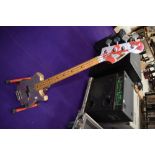 A vintage bass guitar, headstock labelled Satellite