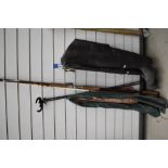 Two sea fishing rods, tripod rest and a pair of waders