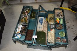A metal tool box containing vintage fishing tackle, with some interesting pieces worth a look