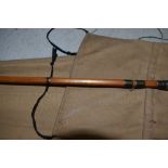 A split cane fly rod marked D. Pollard with sleeve