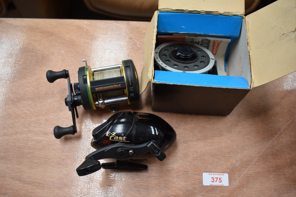 An Abu Ambassadeur reel, an E-Z cast and a Garcia Mitchell 710 spinning reel