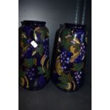 A pair of Royal Stanley Ware vase having the Jacobean design 35cm high