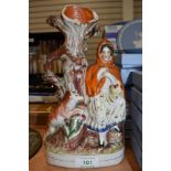 A ceramic Staffordshire figure base or spill vase depicting Little red riding hood and wolf