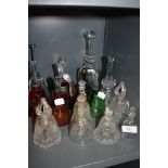 A collection of glass bells, including crystal and cut glass, some colourful ones too with gilt