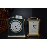 Two clocks of small size a Royal Doulton mantle clock and similar brass cased Wm, Widdop having