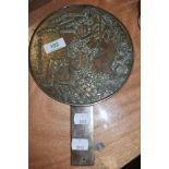 A brass cast Chinese export fan or polished mirror back depicting coy carp and having character