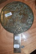 A brass cast Chinese export fan or polished mirror back depicting coy carp and having character