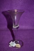 A wine glass having trumpet bowl with opaque enamel (possibly a twist gone wrong?) with elongated