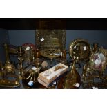 A collection of brass including candlesticks, horse brasses, belt buckle,billows,trivets and and
