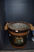 A vintage style coal or fire bucket having rope handle copper banding and armorial transfer