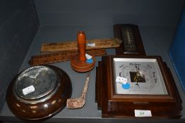 An assortment of items including Barometers, wooden darning mushroom, clay pipe and two foldable