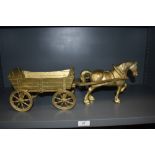 A brass cast model of a horse and cart