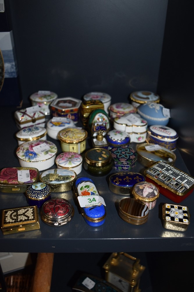 A selection of pill snuff and similar trinket cases including hand decorated and Limoges