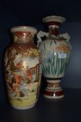 Two Japanese vase one having twin handle design and similar highly decorated with Samurai