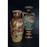 Two Japanese vase one having twin handle design and similar highly decorated with Samurai