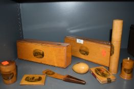 An array of Mauchline ware,including items of interest to the Blackpool, Ilkley and Leeds areas also