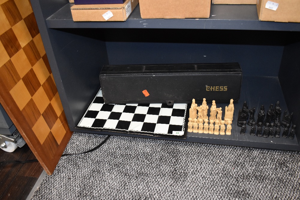 A selection of chess items and games including wooden veneered board