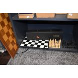 A selection of chess items and games including wooden veneered board