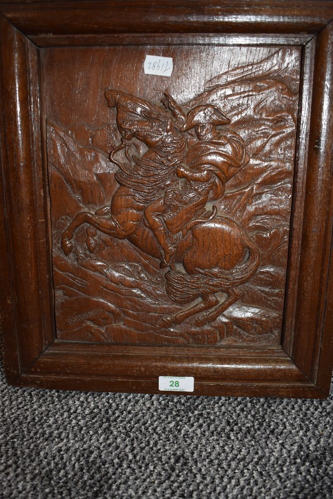 A hand carved oak plaque depicting Napoleon on horse back carved Bonapart carved by A Tancook with