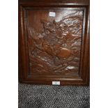 A hand carved oak plaque depicting Napoleon on horse back carved Bonapart carved by A Tancook with