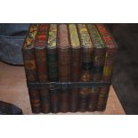 A collectable antique Huntley and Palmer biscuit tin fashioned in the form of library books, bound