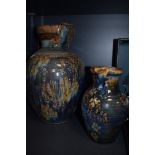 Two British studio pottery jugs by local potter John Calver hand thrown and decorated in blue