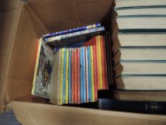 A box of mainly childrens volumes including Ladybird, Arthur Ransome etc