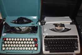 Two vintage typewriters, a Silver-Reed and a Smith-Corona.