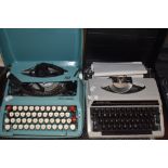 Two vintage typewriters, a Silver-Reed and a Smith-Corona.