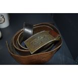 Two vintage leather and brass buckled belts
