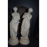 Two parian ware figures of classical maidens bathing one having hairline crack to arm both stand