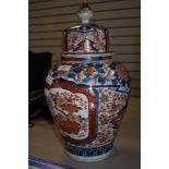 A large Chinese export hard paste lidded urn in Imari Palette 40cm hand decoarted with Moth,