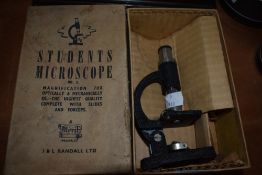 A vintage students microscope in box, J and L Randall LTD.
