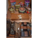 A miscellany of vintage styled advertising tins, a set of dominoes in box, butter pats,