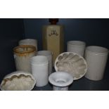 A collection of vintage and antique ceramics including jars and jelly moulds.