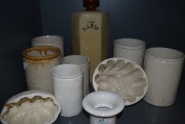 A collection of vintage and antique ceramics including jars and jelly moulds.