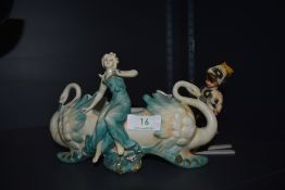 A slipcast table centre or posy vase of woman seated on swans