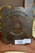 A metal Perpetual calendar having Chinese design for the year 1939 up to 1966.