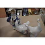 Three figurines, two NAO ducks and a girl with basket by Lladro.