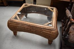 A modern wicker and glass coffee table, approx. 70 x 80cm