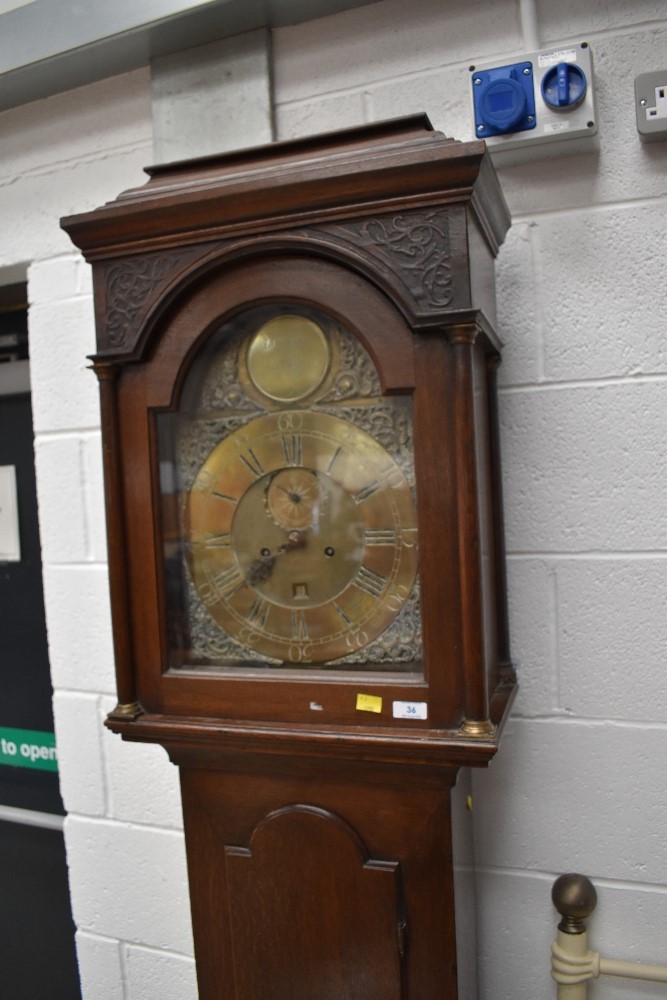 A late 18th Century oak cased long case clock having 8 day movement with 30cm brass face, recessed