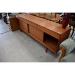 A vintage teak sideboard, Scandinavian probably Danish, triple frieze drawers (centre lined for