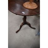 A 19th Century oak pedestal table, diameter approx. 63cm, having tilt top mechanism on triple